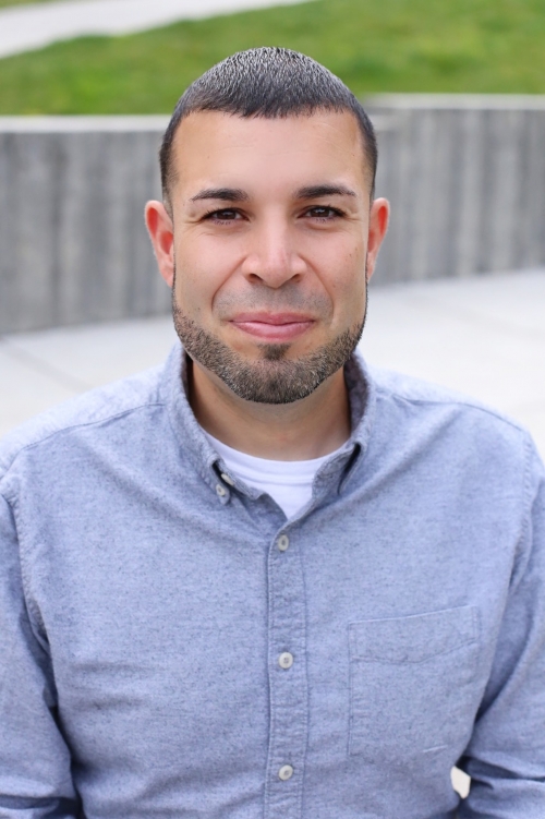 Jonathan Rosa in a blue button-down shirt